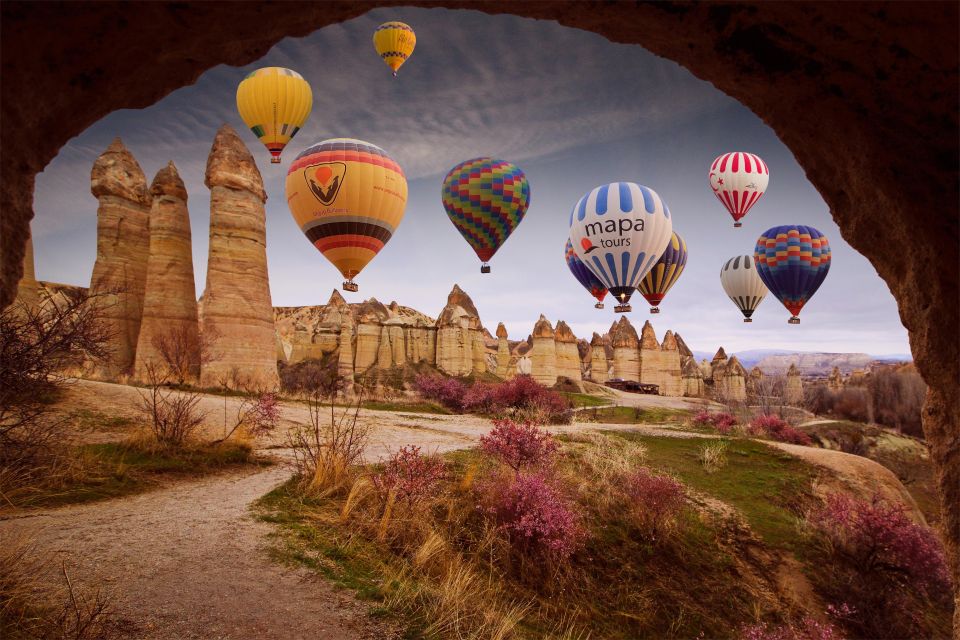Cappadocia: Sunrise Hot Air Balloon Watching Experience - The sunrise moment: watching balloons climb over red rock valleys